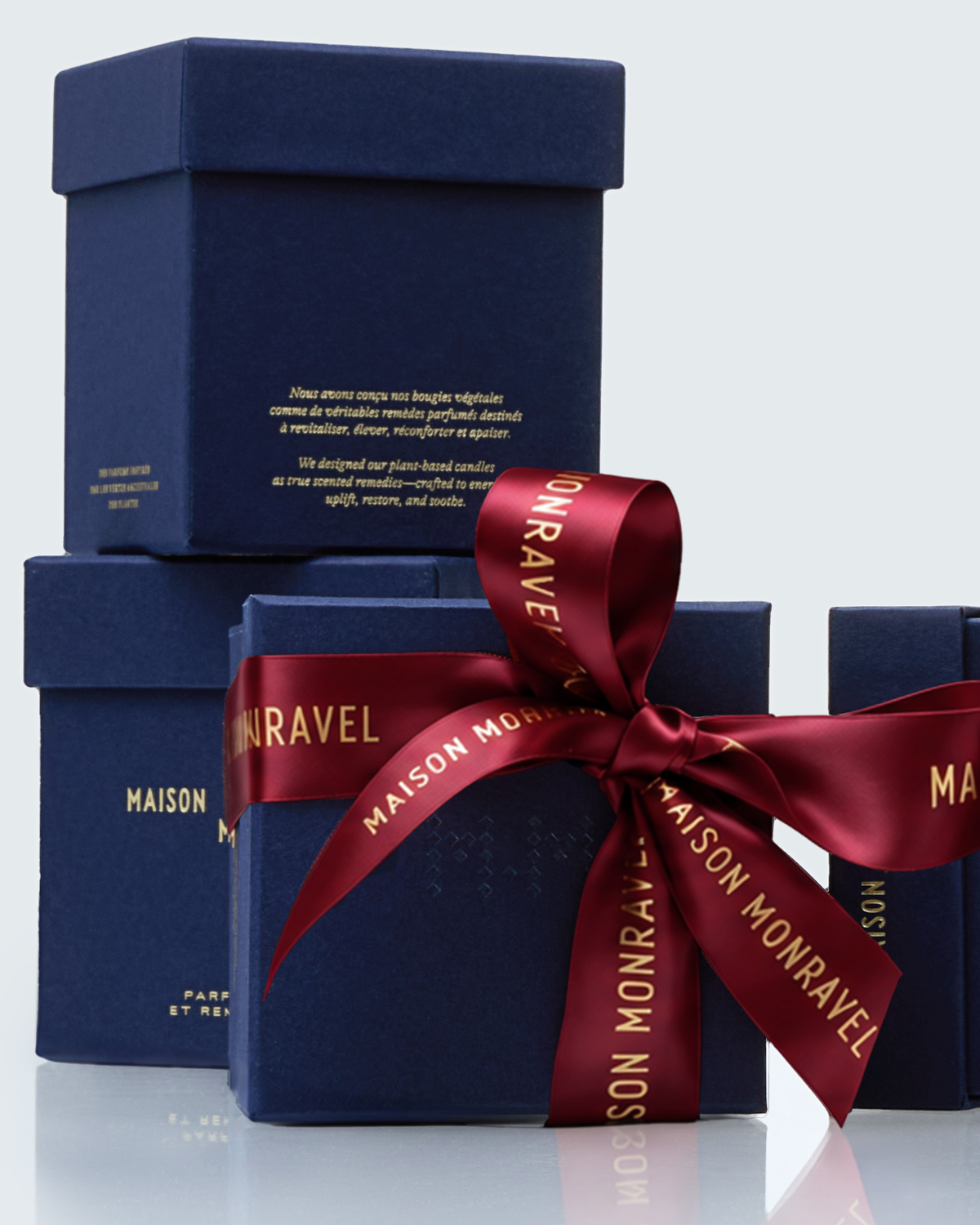 Maison Monravel indigo blue gift boxes tied with a madder-red ribbon